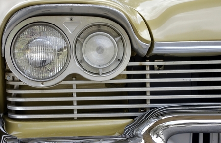 Classic vintage car detail with grille and headlightの写真素材