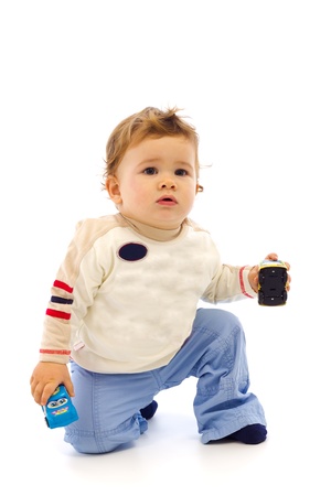 Little baby boy playing with different carsの写真素材