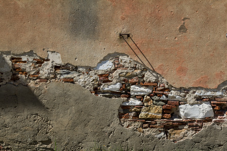 Broken Plaster exposing Bricks underneathの写真素材