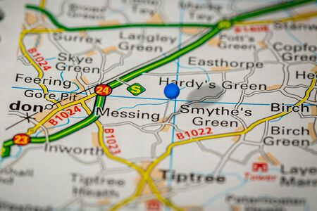 Blue Map Pin on Paper Map Showing Messing
