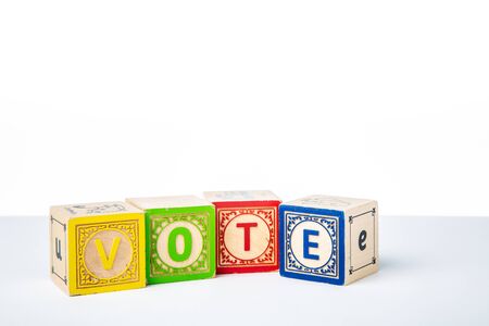Childrens Wooden Alphabet Blocks Spelling the Word Voteの写真素材