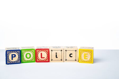 Childrens Wooden Alphabet Blocks Spelling the Word Policeの写真素材