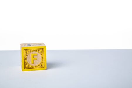 Childrens Wooden Alphabet Block Showing the Letter Fの写真素材