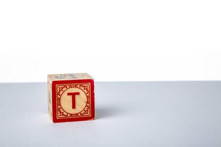 Childrens Wooden Alphabet Block Showing the Letter Tの写真素材