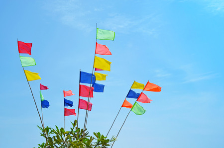 Colored flags in the windの写真素材
