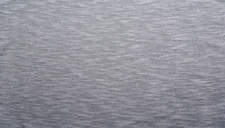 Gray fabric texture. Clothes background. Close up