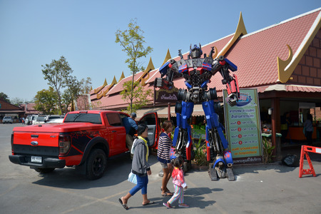 AYUTTAYA,THAILAND - DECEMBER 28, 2013 : The Replica of Optimus Prime robot made from iron part of a Car display at Thung Bua Chom floating marketのeditorial素材