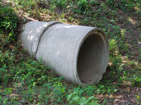 Concrete pipe under the road for the water to flow through.の写真素材