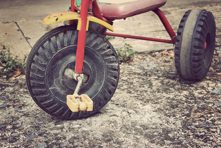 closeup wheel of old tricycle, retro vintage styleの写真素材