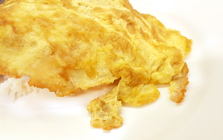 Close up omelet on rice in white dishの写真素材