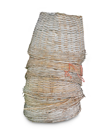 Bamboo baskets overturned on white backgroundの写真素材