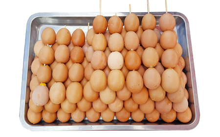 grilled eggs in tray steel on white backgroundの写真素材