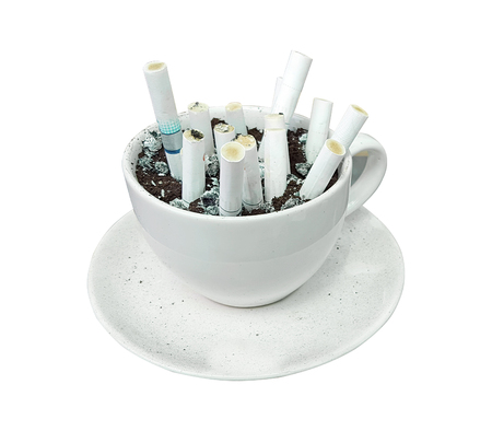 Coffee mugs and coffee grounds for cigarette butts.の写真素材