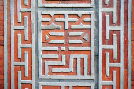 Plaster pattern on brick wall