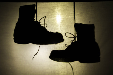 Boots shadow at look past canvases background.の写真素材