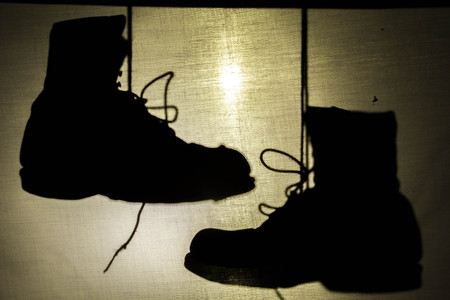 Boots shadow at look past canvases background.の写真素材