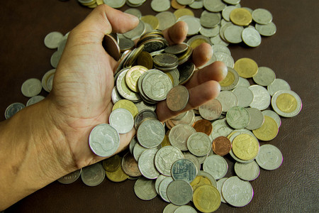 Saving money coins. Coins of Thailand background.の写真素材