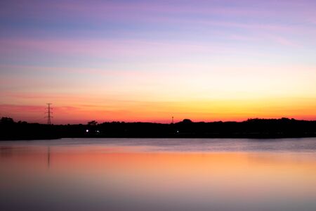 Evening atmosphere on the edge of a large swamp.When the sun goes down.の写真素材