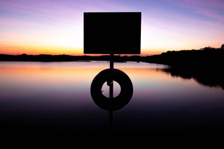 Evening atmosphere on the edge of a large swamp.When the sun goes down.の写真素材