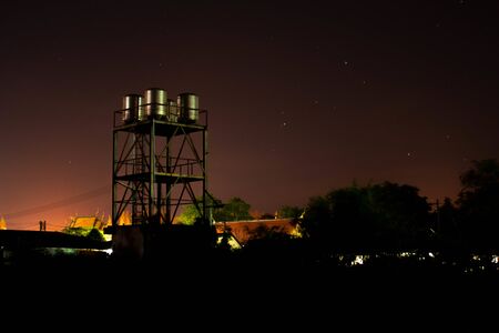 The atmosphere in the far corner at night of a large factoryの写真素材