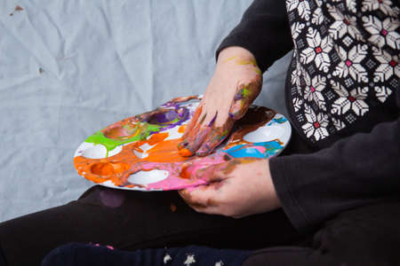 messy finger painting fun toddler hands and fingersの写真素材