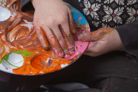 messy finger painting fun toddler hands and fingersの写真素材
