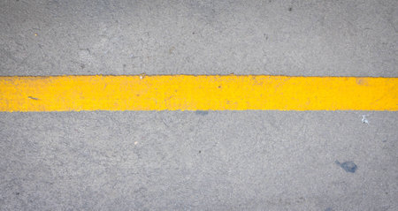 yellow line on asphalt road textureの写真素材