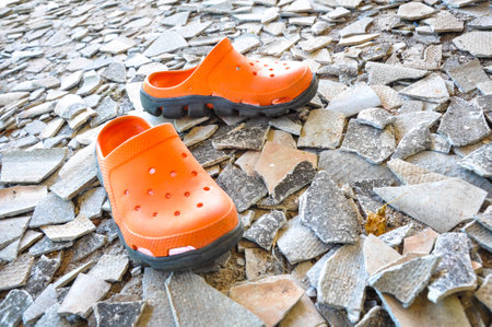 Orange boots on the groundの写真素材