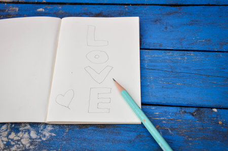 Notebook on a wooden tableの写真素材