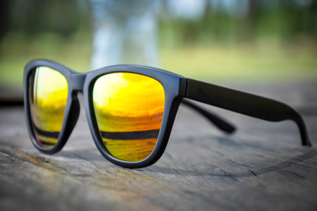 Sunglasses on old woodの写真素材
