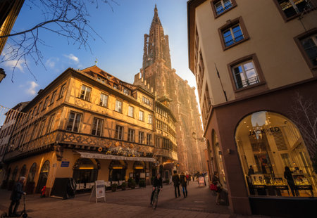 STRASBOURG, FRANCE - JANUARY 5, 2017: View of the traditional half-timbered house and the Cathedral of Strasbourg. Pedestrian street in the old part of the city, Alsace.のeditorial素材