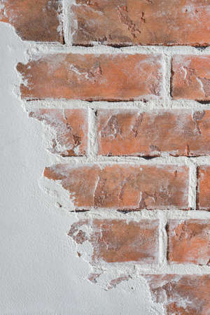 Shabby masonry imitating an old wall. Textured vertical background. Decorative wall plaster,...