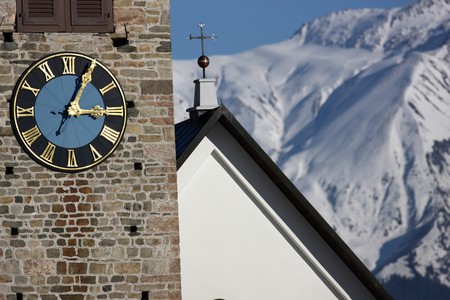 Detail view of clock on a church tower showing five past threeの写真素材