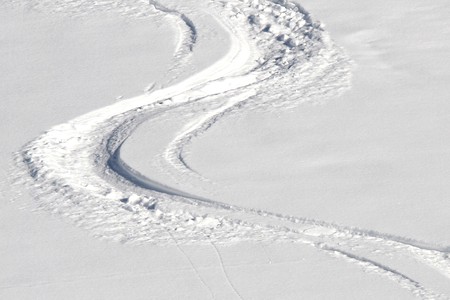 Ski tracks in the powder snowの写真素材