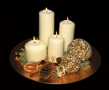 Original advent wreath with four burning candles isolated on a black backgroundの写真素材