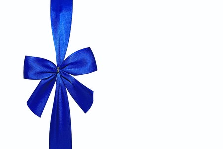 Close view of a blue bow isolated on a white background の写真素材