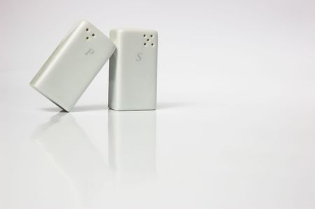 Salt and pepper shaker, isolated on white background.の写真素材