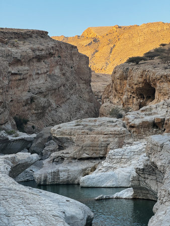 Wadi Bani Khalid is a popular Omani oasis featuring large, swimmable emerald-green pools and canyon landscapes in Oman. A Desert Paradise with Serene Water Pools and Stunning Canyonsの写真素材