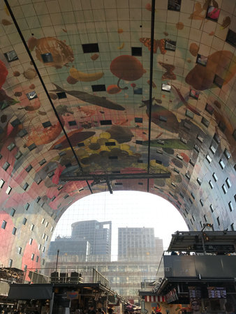 Rotterdam, Netherlands, May 8, 2018, Markthal, vivid marketplace teeming with culinary experts and busy shoppers moving around, vibrant outdoor market where chefs prepare and excited shoppers explore lively stallsのeditorial素材
