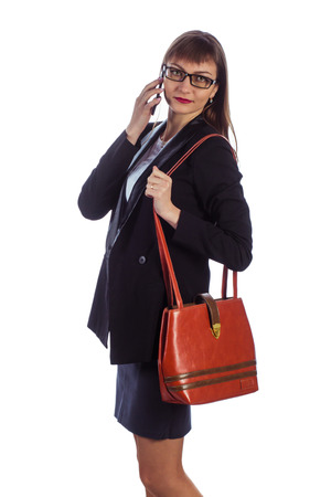 Business woman with a mobile on a white backgroundの写真素材