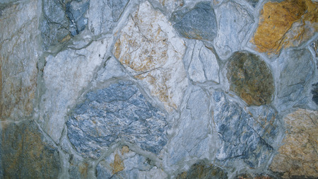 plinth of gray and yellow decorative stone, close-up