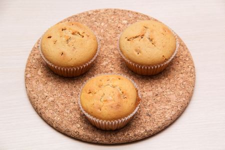 three cupcake stand on the stand of corkの写真素材