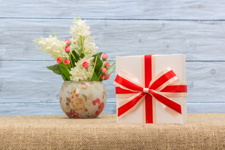 gift and a vase with flowers, closeupの写真素材