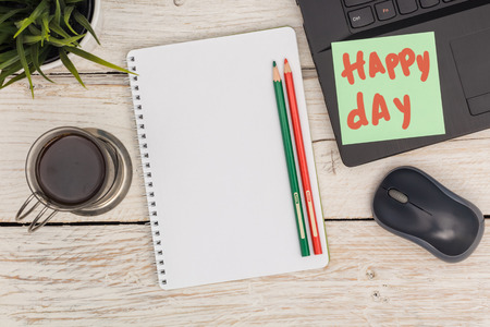 happy day at the office: notebook, laptop and coffee, view from aboveの写真素材