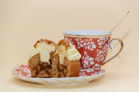 cupcakes on a plate and cup of teaの写真素材