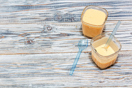 fruit yogurt stands on the aged boards, copyspaceの写真素材
