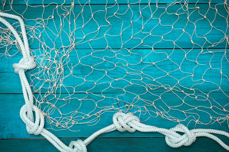 Marine Network and rope on white old boards, copyspaceの写真素材