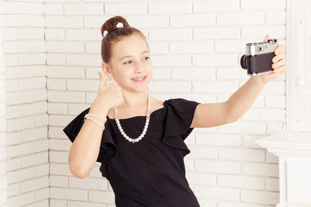 little girl says and does selfie cameraの写真素材