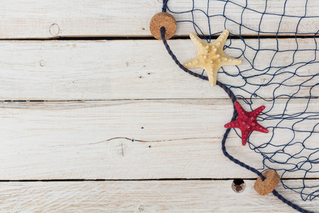 starfish, marine network and rope on the old board, flat layの写真素材