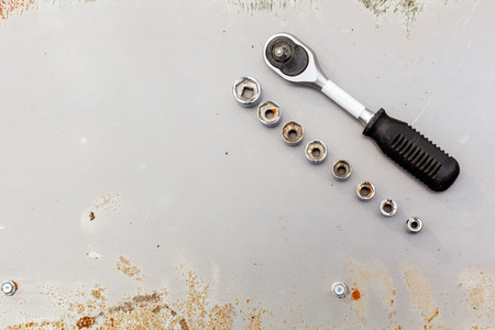 one wrench on rusty metal, flat layの写真素材